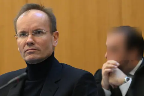 Markus Braun waits in the Munich courtroom for the start of his trial