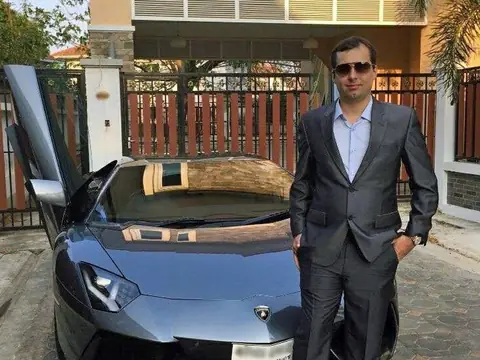 Alexandre Cazes with his Lamborghini Aventador outside a house in Thailand, in a photo he posted to Facebook