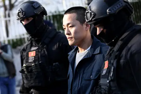 Police officers escorting Do Kwon in Podgorica in 2024