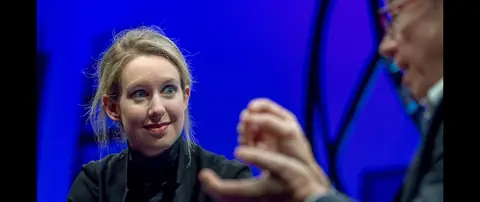 Holmes defends Theranos on stage at the Fortune Global Forum, interviewed by Fortune's Alan Murray