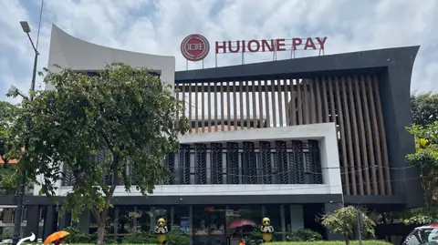 Huione Pay's headquarters in Phnom Penh, with the two panda statues at the door, the day after FinCEN proposed cutting the group off