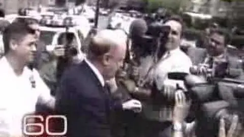 Kozlowski pushing through a media scrum, in CBS News' 2007 prison interview report
