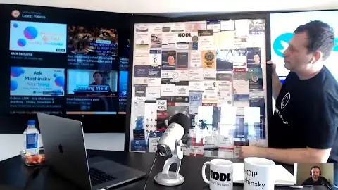 An "Ask Mashinsky Anything" livestream: Mashinsky in his studio, a wall of crypto stickers and HODL mugs, pitching "what it takes to unbank the world"