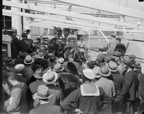 Newsreel: 'Deport Ponzi!' - cameras film Ponzi on the deck of the Vulcania as he is sent to Italy