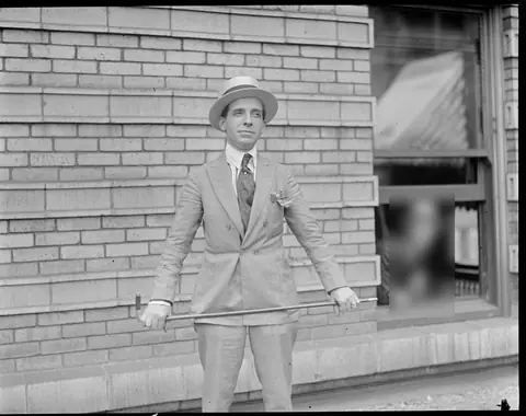 Charles Ponzi, with gold-handled cane and diamond stickpin, at the height of the Securities Exchange Company boom