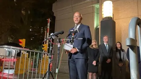 Prosecutors address reporters outside the courthouse on the night of the verdict