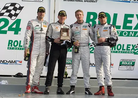 Tucker on the Daytona podium with co-drivers Richard Westbrook, Ryan Hunter-Reay and Lucas Luhr after the 2010 Rolex 24